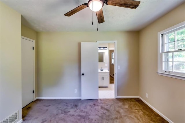 516 Jordan Dr NW, Tucker, GA 30084 - unfurnished bedroom with carpet and a ceiling fan