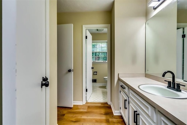 516 Jordan Dr NW, Tucker, GA 30084 - bathroom featuring vanity and wood finished floors