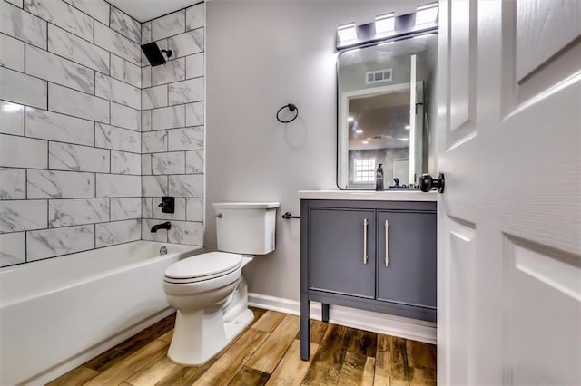 516 Jordan Dr NW, Tucker, GA 30084 - bathroom with vanity, washtub / shower combination, and wood finished floors