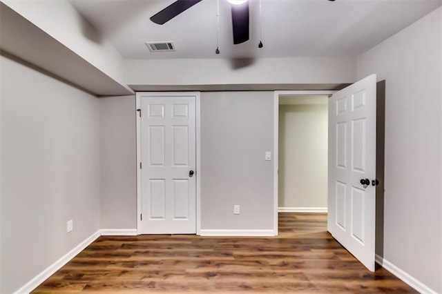 516 Jordan Dr NW, Tucker, GA 30084 - unfurnished bedroom featuring wood finished floors, a ceiling fan, and a closet