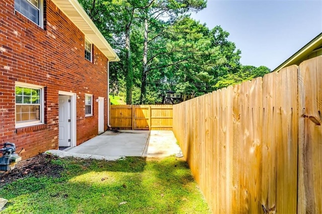 516 Jordan Dr NW, Tucker, GA 30084 - fenced backyard featuring a patio area