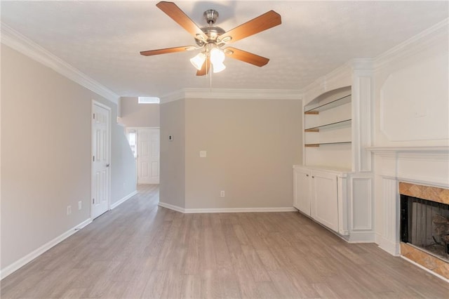 6683 Princeton Park Ct, Lithonia, GA 30058 - unfurnished living room with ceiling fan, light wood-style flooring, a premium fireplace, ornamental molding, and baseboards