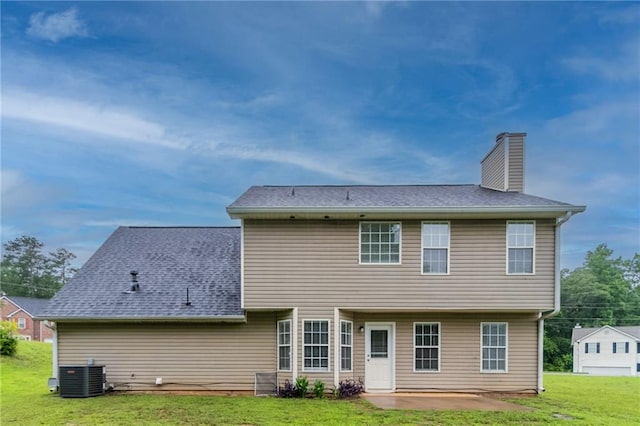 6683 Princeton Park Ct, Lithonia, GA 30058 - rear view of property featuring a chimney, a lawn, a patio, and central AC