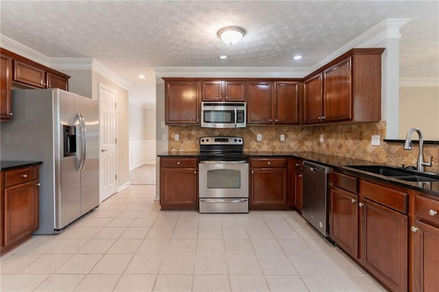 6683 Princeton Park Ct, Lithonia, GA 30058 - kitchen with stainless steel appliances, a sink, ornamental molding, a wainscoted wall, and light tile patterned floors
