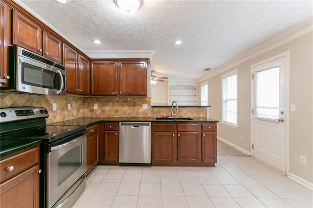 6683 Princeton Park Ct, Lithonia, GA 30058 - kitchen with appliances with stainless steel finishes, a sink, dark countertops, a peninsula, and tasteful backsplash