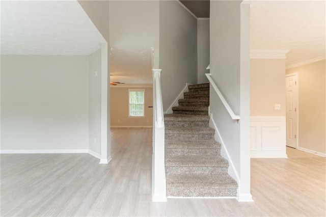 6683 Princeton Park Ct, Lithonia, GA 30058 - staircase with wood finished floors and ornamental molding
