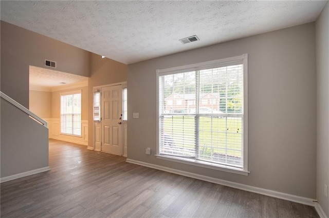 6683 Princeton Park Ct, Lithonia, GA 30058 - entrance foyer featuring wood finished floors, a textured ceiling, baseboards, and stairway
