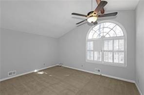 empty room with baseboards, ceiling fan, visible vents, and lofted ceiling