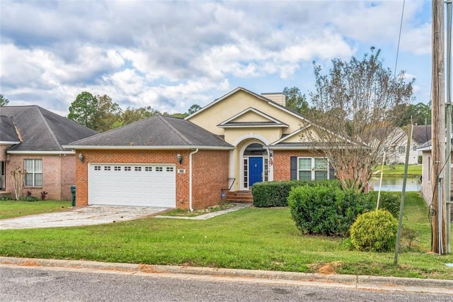 view of front of house with a front yard and a garage