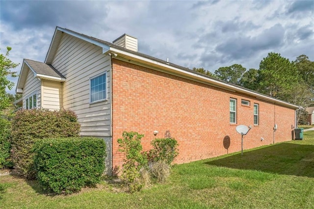 view of property exterior with a lawn