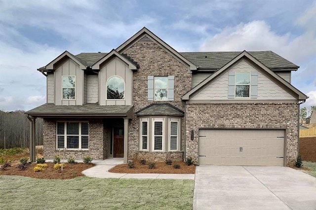 view of front of house featuring a garage and a front yard