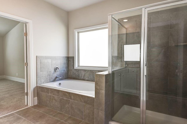 bathroom featuring tile patterned flooring and independent shower and bath