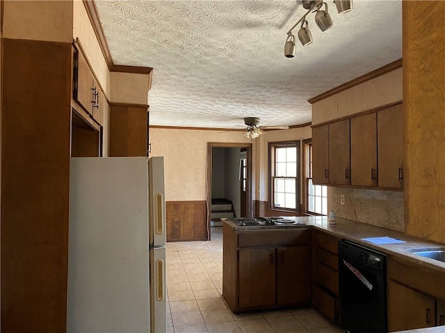 kitchen featuring dishwasher, crown molding, ceiling fan, a textured ceiling, and white fridge