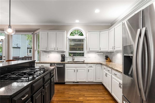 2759 Thomashire Trce, Marietta, GA 30066 - kitchen featuring appliances with stainless steel finishes, white cabinets, crown molding, pendant lighting, and dark wood finished floors