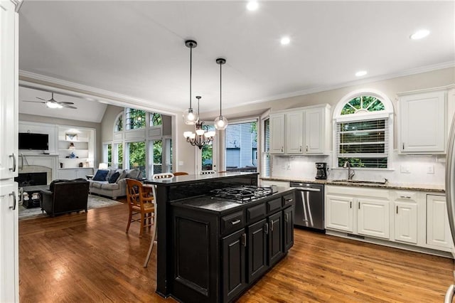 2759 Thomashire Trce, Marietta, GA 30066 - kitchen featuring dishwasher, dark cabinets, white cabinetry, a kitchen bar, and crown molding