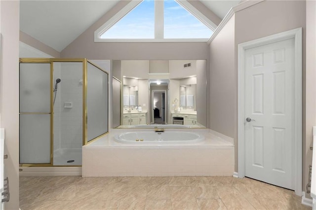 2759 Thomashire Trce, Marietta, GA 30066 - bathroom featuring lofted ceiling, a garden tub, a stall shower, and vanity