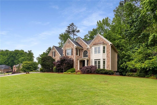 2759 Thomashire Trce, Marietta, GA 30066 - view of front facade featuring a front lawn and brick siding