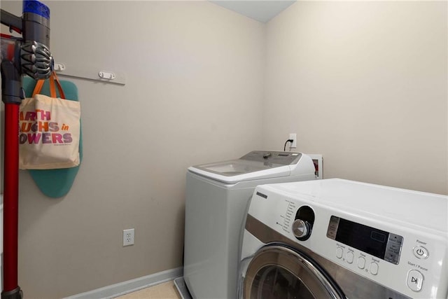 2759 Thomashire Trce, Marietta, GA 30066 - washroom with washing machine and clothes dryer and baseboards