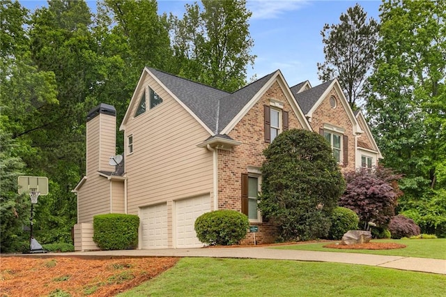 2759 Thomashire Trce, Marietta, GA 30066 - view of front of house with brick siding, an attached garage, a front yard, a chimney, and driveway