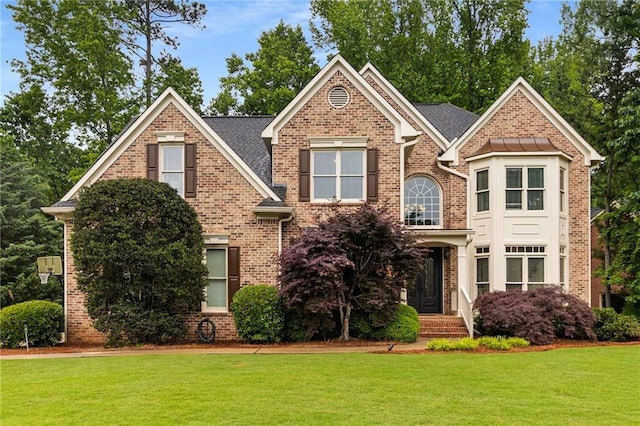 2759 Thomashire Trce, Marietta, GA 30066 - traditional-style house featuring a front lawn and brick siding