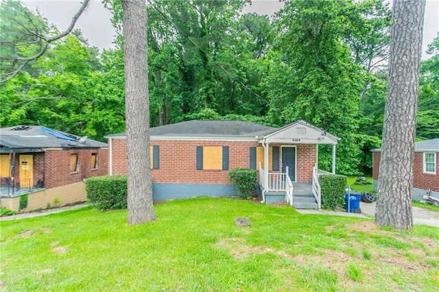 2817 Burton Rd NW, Atlanta, GA 30311 - view of front facade with brick siding and a front yard