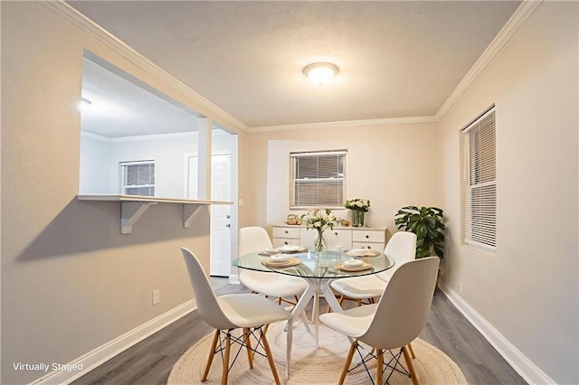 2817 Burton Rd NW, Atlanta, GA 30311 - dining space featuring dark wood-type flooring, baseboards, and ornamental molding