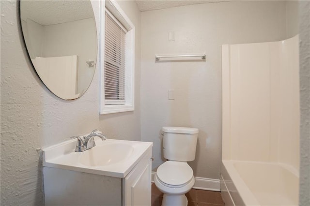 2817 Burton Rd NW, Atlanta, GA 30311 - bathroom featuring vanity, toilet, a textured ceiling, baseboards, and a textured wall