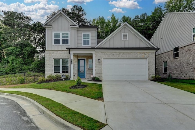 view of front of home featuring board and batten siding, an attached garage, concrete driveway, and brick siding
