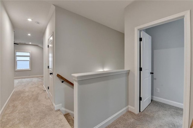 corridor featuring an upstairs landing, carpet, recessed lighting, and baseboards