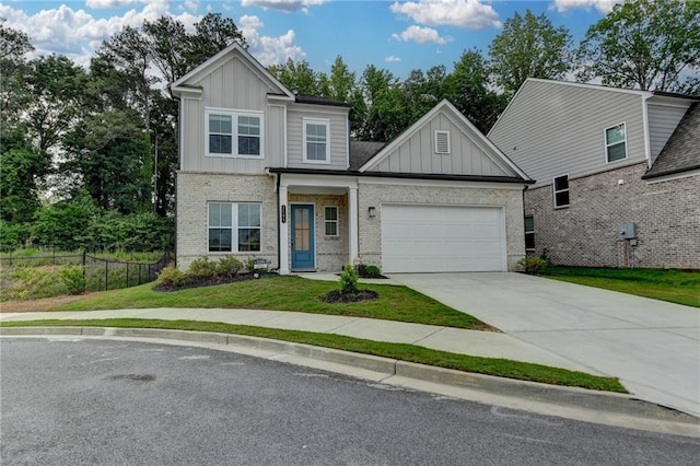 view of front of home with board and batten siding, a garage, concrete driveway, and brick siding