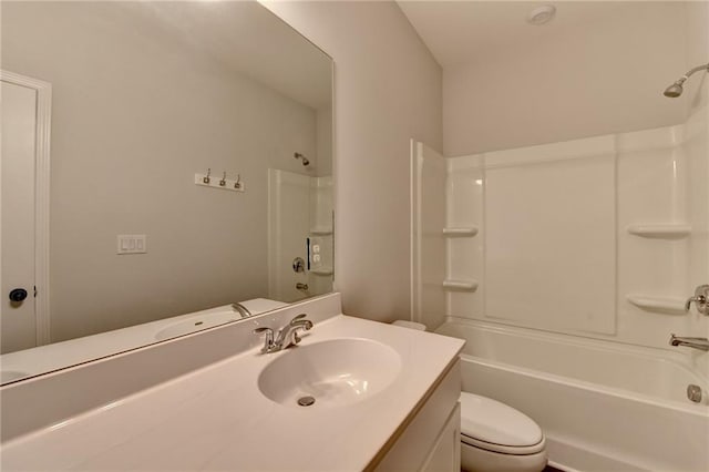 full bath with toilet, vanity, and shower / washtub combination