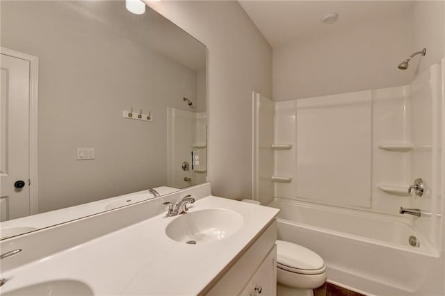 bathroom with toilet, double vanity, and bathtub / shower combination