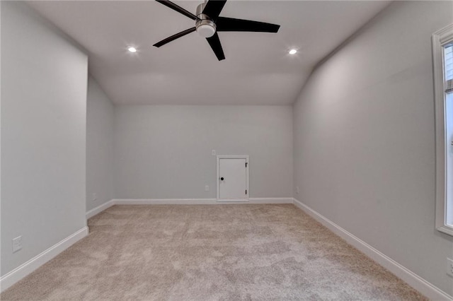 additional living space featuring ceiling fan, light colored carpet, lofted ceiling, recessed lighting, and baseboards