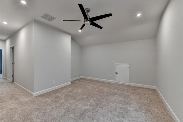 additional living space featuring carpet flooring, a ceiling fan, baseboards, recessed lighting, and vaulted ceiling