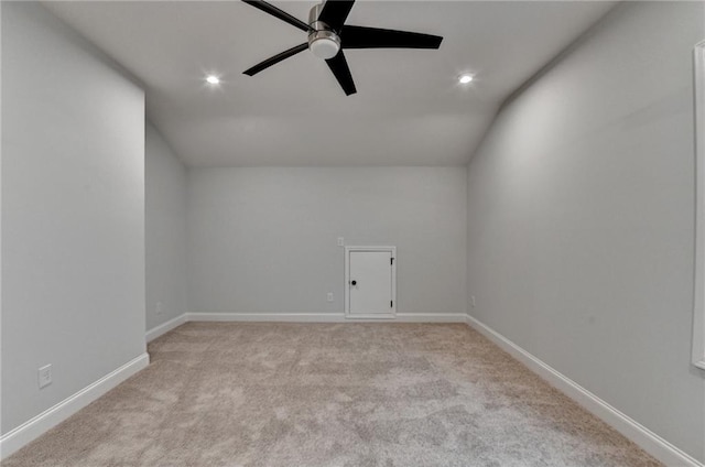 additional living space featuring light colored carpet, ceiling fan, recessed lighting, baseboards, and lofted ceiling
