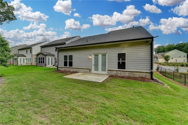 rear view of house with a patio