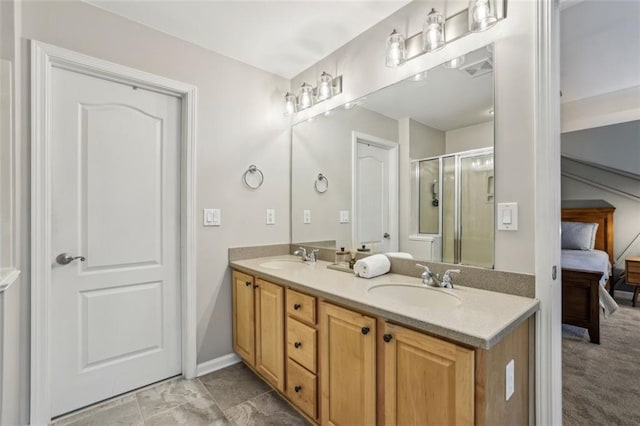 ensuite bathroom featuring ensuite bath, double vanity, a stall shower, and a sink