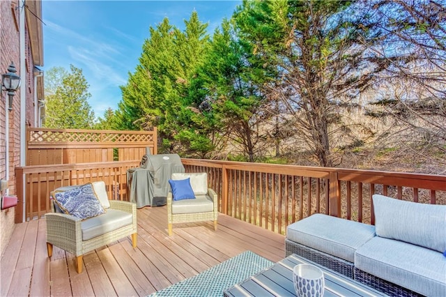 wooden deck featuring area for grilling