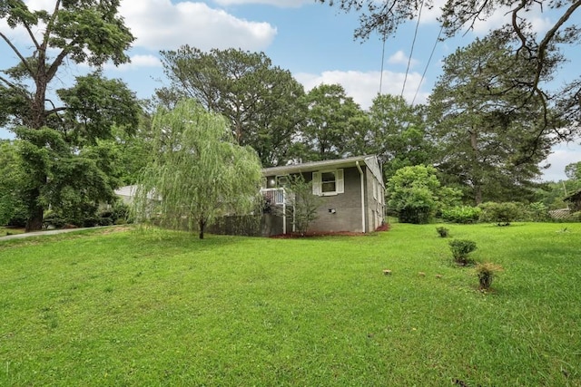 1977 Wee Kirk Rd SE, Atlanta, GA 30316 - back of property at dusk with a shingled roof, a patio, a gate, and view of wooded area