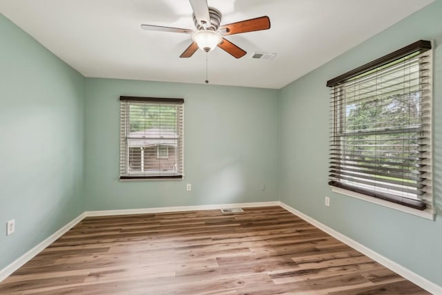 1977 Wee Kirk Rd SE, Atlanta, GA 30316 - kitchen with appliances with stainless steel finishes, arched walkways, light wood finished floors, light stone countertops, and recessed lighting