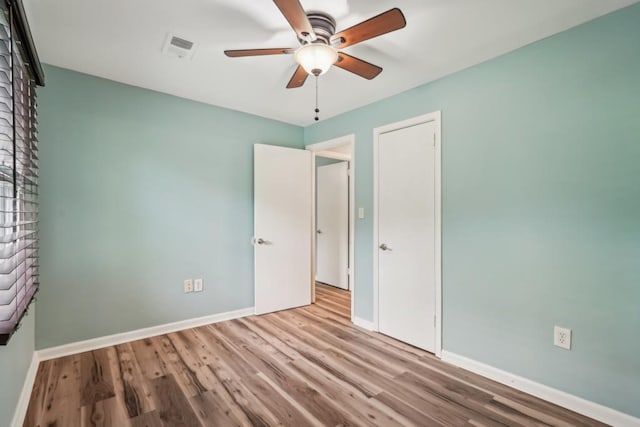 1977 Wee Kirk Rd SE, Atlanta, GA 30316 - bathroom featuring wood finished floors, toilet, vanity, curtained shower, and baseboards