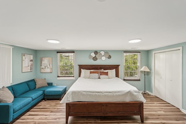 1977 Wee Kirk Rd SE, Atlanta, GA 30316 - bedroom with light wood finished floors, a closet, and baseboards