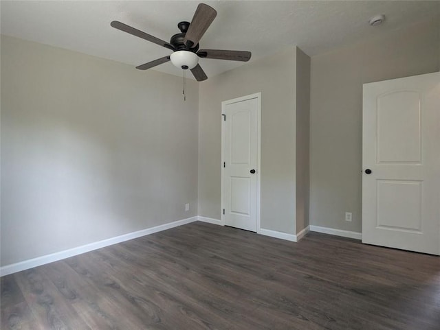 732 Five Points Rd, Buchanan, GA 30113 - unfurnished bedroom featuring dark wood-style flooring and ceiling fan