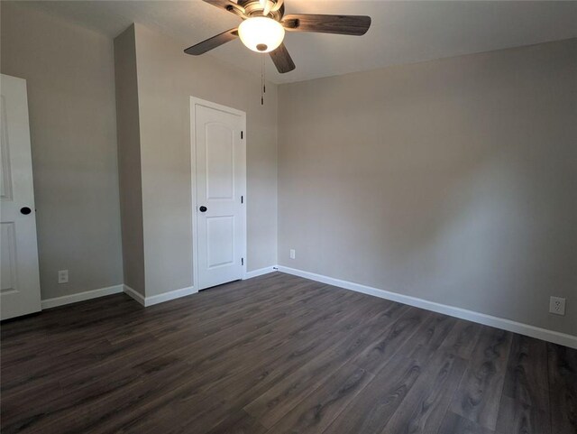 732 Five Points Rd, Buchanan, GA 30113 - unfurnished bedroom featuring dark wood-style flooring and a ceiling fan