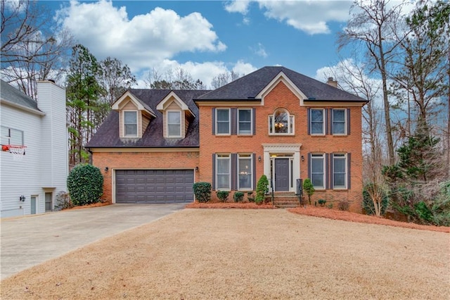 colonial inspired home featuring a garage