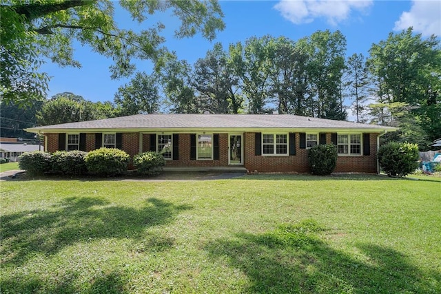 1663 Pounds Rd SW, Stone Mountain, GA 30087 - single story home with a front lawn and brick siding
