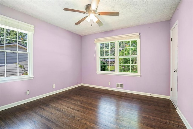 1663 Pounds Rd SW, Stone Mountain, GA 30087 - spare room with wood finished floors, ceiling fan, baseboards, and a textured ceiling