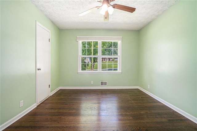 1663 Pounds Rd SW, Stone Mountain, GA 30087 - empty room with ceiling fan, a textured ceiling, wood finished floors, and baseboards