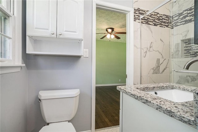 1663 Pounds Rd SW, Stone Mountain, GA 30087 - full bath featuring ceiling fan, a tile shower, baseboards, and toilet