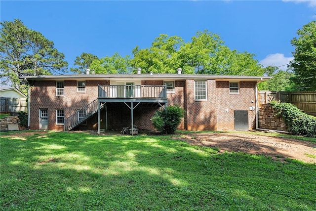 1663 Pounds Rd SW, Stone Mountain, GA 30087 - back of property featuring stairs, a deck, and brick siding
